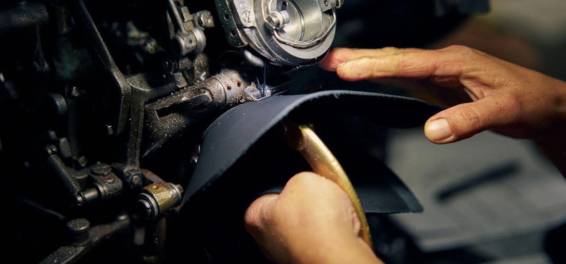 Red Wing boot being hand-stitched in the factory